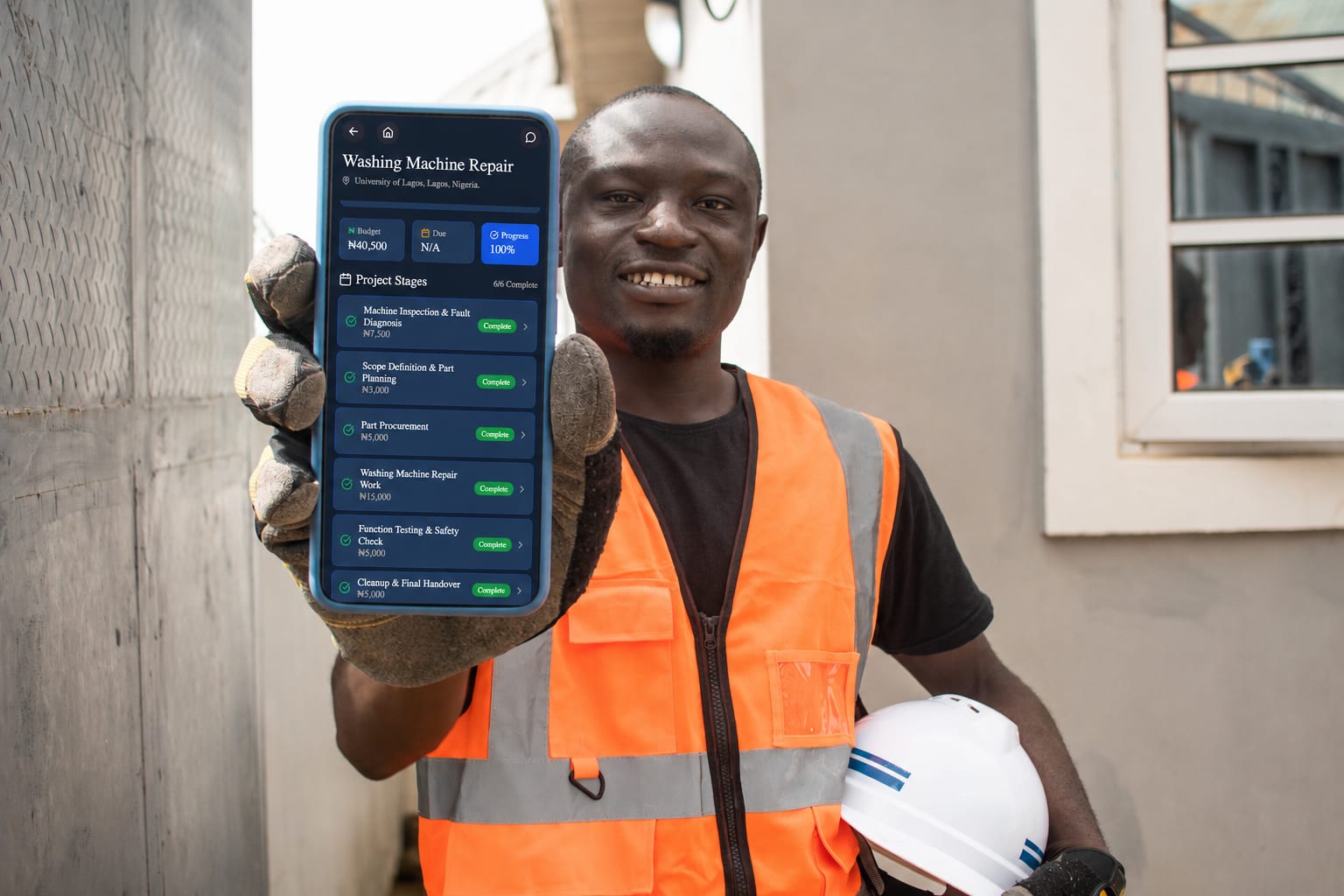 BuildMyHouse engineer showing project stages on a phone